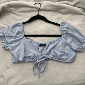 light blue solid knot front top